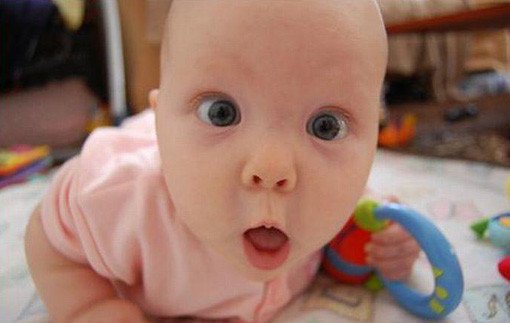 funny baby photos surprised girl in pink