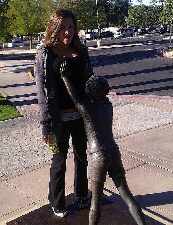 statue feeling up woman