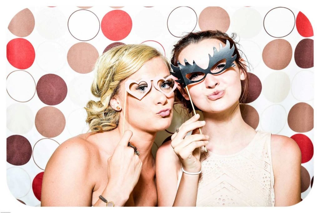 bachelorette party ideas two girls with photobooth props