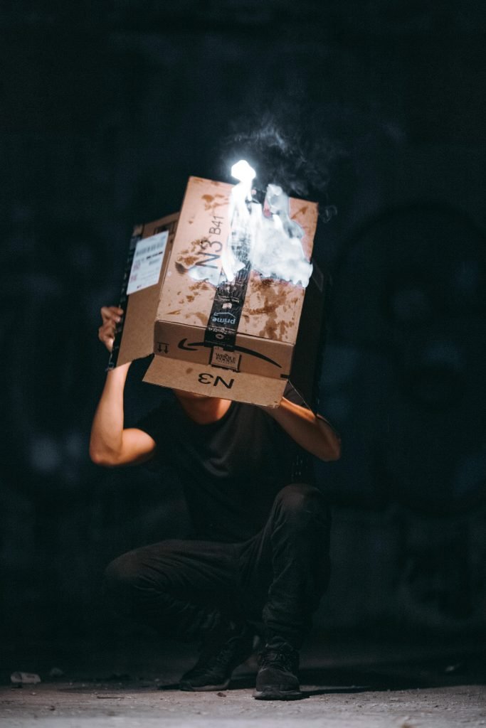 man raising cardboard box 2257704